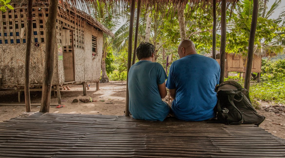 missionary and Filipino friend talking