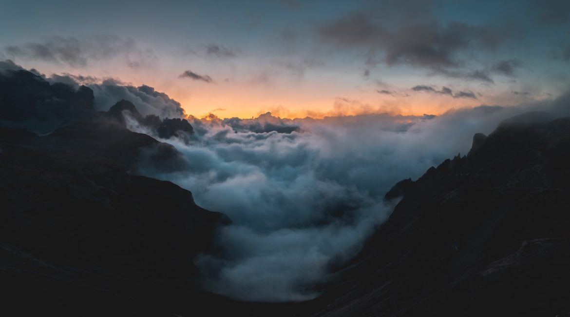 a cloud choked valley in Italy